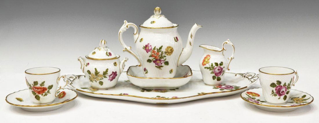 (9) RICHARD GINORI FLORAL TEA SET: (lot of 9) Richard Ginori 'Fleurs par Donnibarozopi' China tea set, polychrome flowers on a white ground with gilt rims, comprising: (1) tea pot, 6.25"h; (1) creamer, 4"h; (1) lidded sugar, 4"h; (2) c