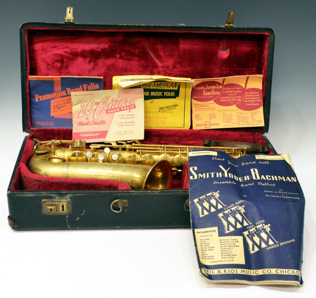 VINTAGE CONN ALTO SAXOPHONE, 1930'S: Conn alto saxophone, manufactured c. 1930, gold tone finish, two mouth pieces, SN M249046 (pat. date 12/8/1914), housed in worn Conn case lacking handle, together with C.G. Conn letter dated 3/21/1975