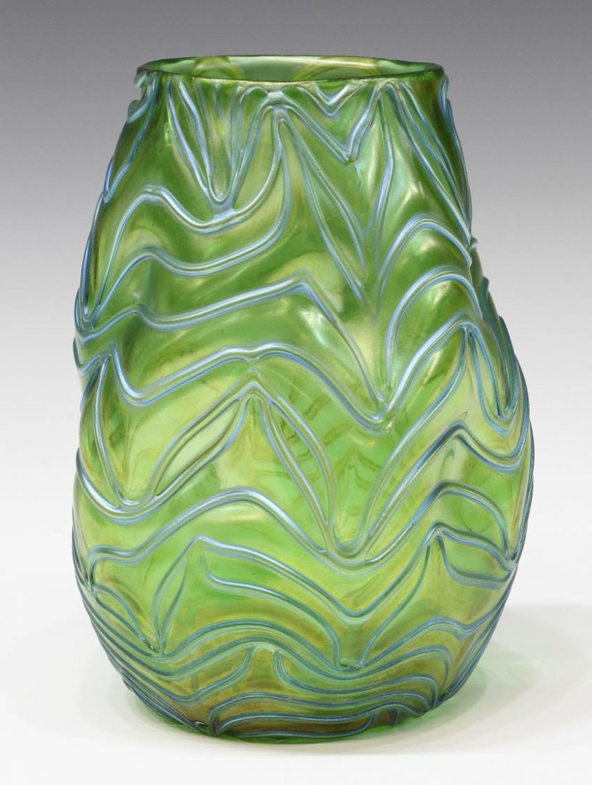 LOETZ 'FORMOSA' GREEN & BLUE ART GLASS VASE: Loetz 'Formosa' art glass vase having a green ground with iridescent blue threading throughout, early 20th c, unsigned, roughness along rim, approx 6.5"h, 1.25lbs Start Price: $200.00