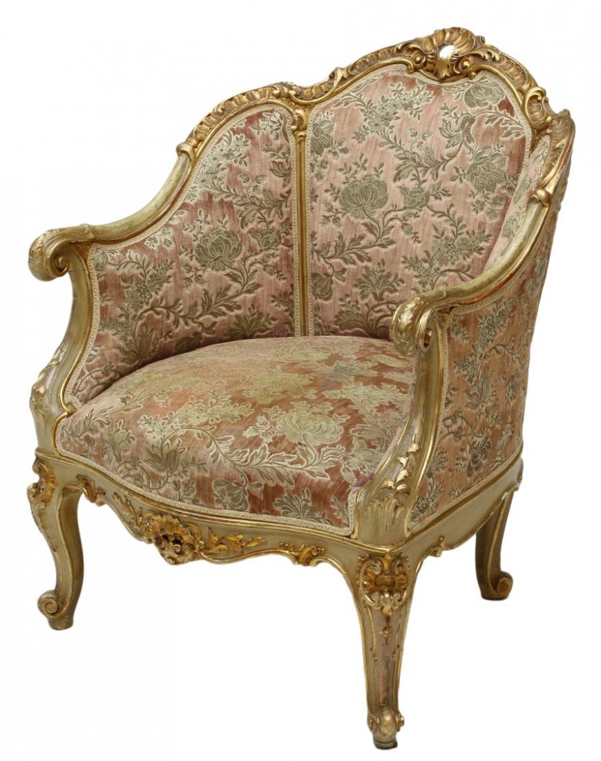 LOUIS XV STYLE GILT FRAMED ARM CHAIR: Louis XV style bergere, late 20th c., a gilt frame enclosing the floral accented upholstery rising on cabriole legs, 34.75"h, 28.25"w, 22.5"d Start Price: $150.00
