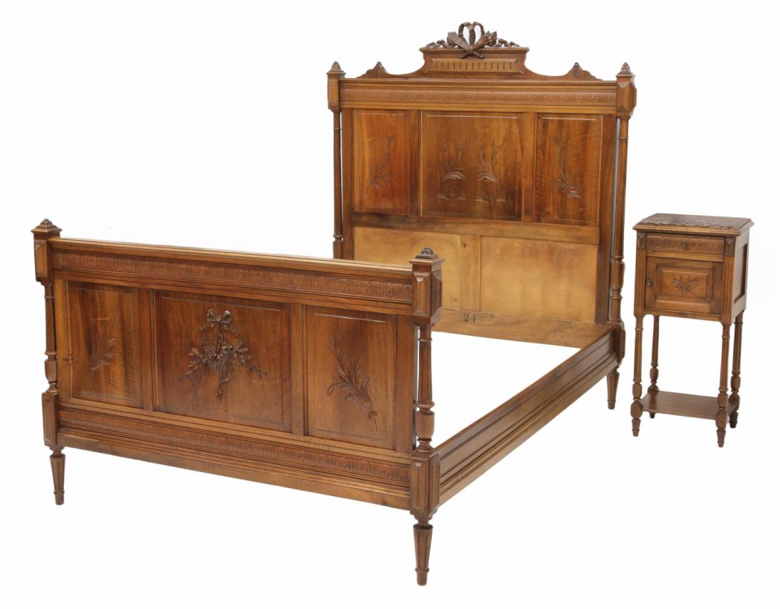 LOUIS XVI STYLE BED & MARBLE TOP NIGHT STAND: (lot of 2) Louis XVI style walnut furniture, c. 1900: (1) bed with pierced carved ribbon, torch and quiver crested headboard and floral carved accents, headboard: 65"h, 57"w, inside: approx 74"l, 52"w
