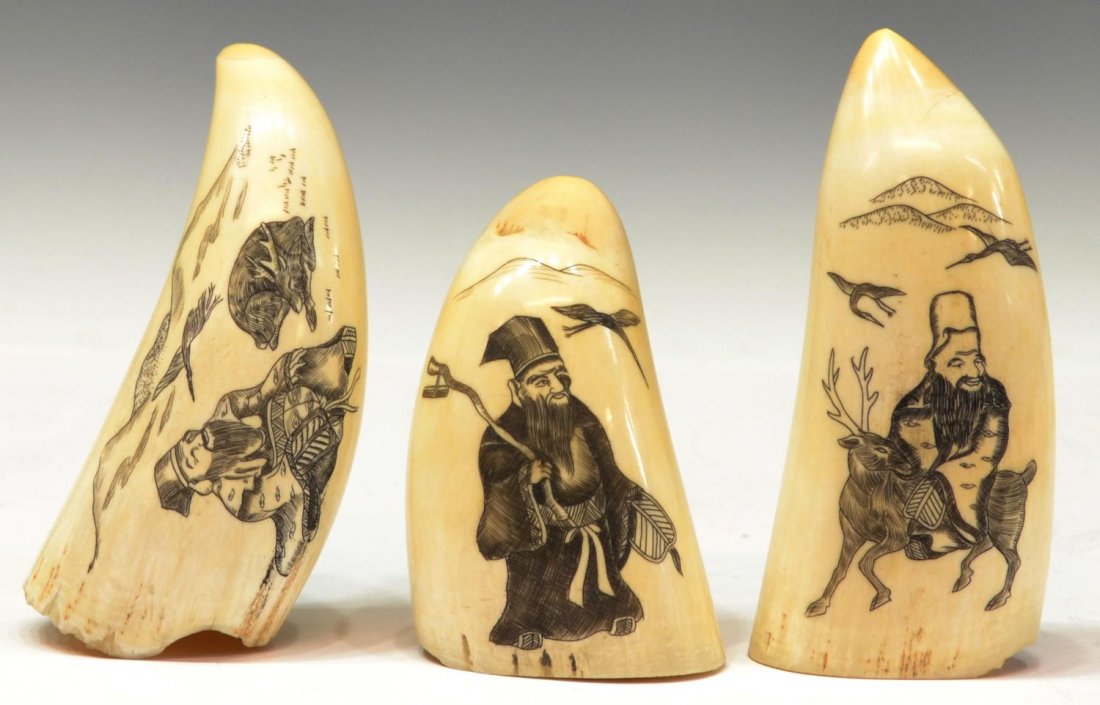 (3) ASIAN FIGURAL SCRIMSHAW IVORY TOOTH CARVINGS: *This lot will not be shipped Internationally* (lot of 3) Scrimshaw ivory tooth carvings: (1) showing an figure with fan, recumbent deer and crane before a mountainous landscape, age lines, loss to ed