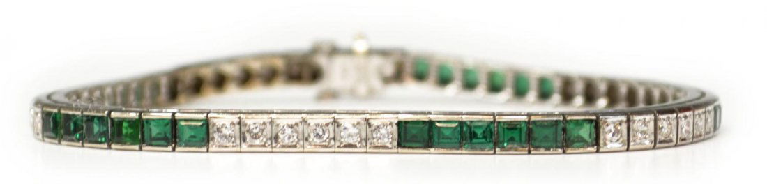 LADIES 14KT, DIAMOND & GREEN SPINEL BRACELET: Ladies 14kt white gold tennis bracelet set with (34) small diamonds and (30) synthetic green spinel stones, 8"l, 17.9 grams (all inclusive) Start Price: $300.00