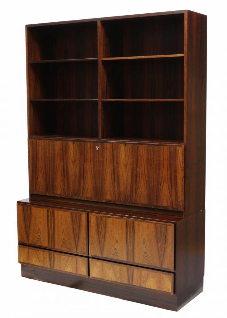 DANISH MID-CENTURY MODERN ROSEWOOD BOOKCASE: Mid-century modern cabinet bearing the tags of Omann Jun Furniture, Denmark, the upper section open with adjustable height shelves over a long hinged door dropping to reveal a fitted interior with she