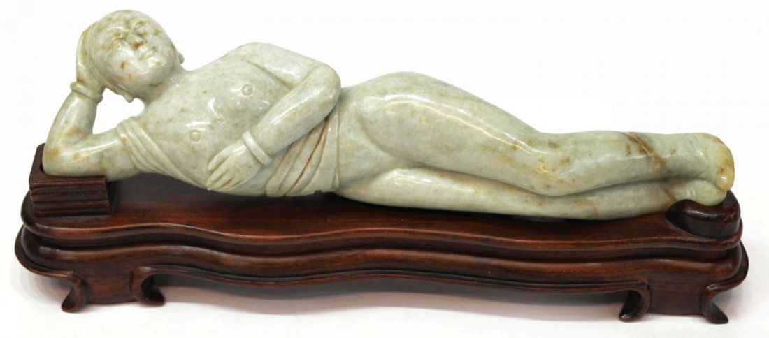 CHINESE CARVED JADE DOCTORS MODEL: Chinese carved jade doctors model, 20th c, pale green stone with russet fissures and striations, mounted on a wood base, 11.5"l, 4.5lbs **Provenance: From the private collection of a Colonel (ret.) in