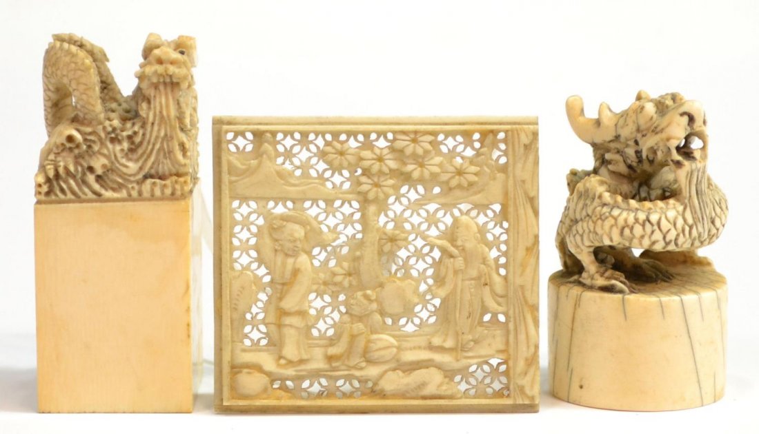 (3) CHINESE CARVED IVORY CHOPS & PIERCED PANEL: *This lot will not be shipped Internationally* (lot of 3) Diminutive ivory carvings: (2) seals, each surmounted by a dragon, one of rectangular form, one circular, largest: 2.25"h; (1) delicate finely