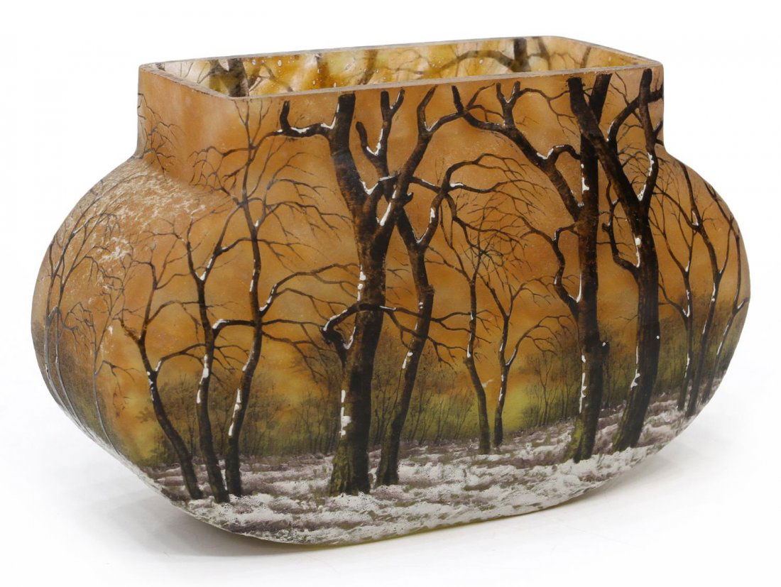 DAUM NANCY CAMEO ART GLASS WINTER LANDSCAPE VASE: Daum Nancy etched and enameled winter scene art glass vase, c. 1900, a snowy treed landscape against the mottled orange ground fading to yellow, signed Daum Nancy with the Cross of Lorraine, roughness