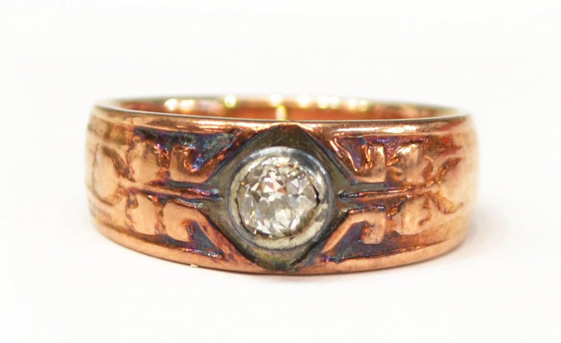 ANTIQUE ESTATE RUSSIAN ROSE GOLD & DIAMOND RING: Ladies Russian antique estate ring executed in 14kt rose and white gold and set with a diamond, hallmarked with the star, hammer, sickle indicating Soviet Russia, 583 for 14kt, the stylized band bezel