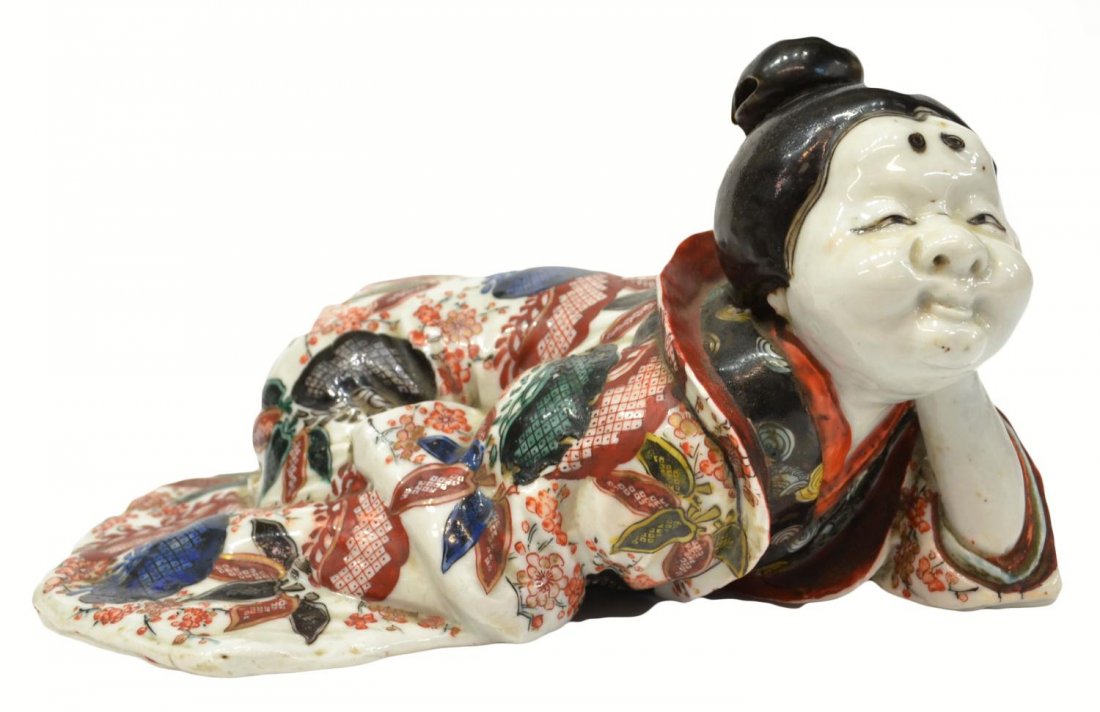 ANTIQUE JAPANESE IMARI PORCELAIN OKAME FIGURE: Japanese Imari porcelain figure of Okame as a court lady, late Tokugawa / Meiji period, restoration near base, approx 5.25”h, 8.5”w, 5.25”d, 3.25lbs Start Price: $150.00