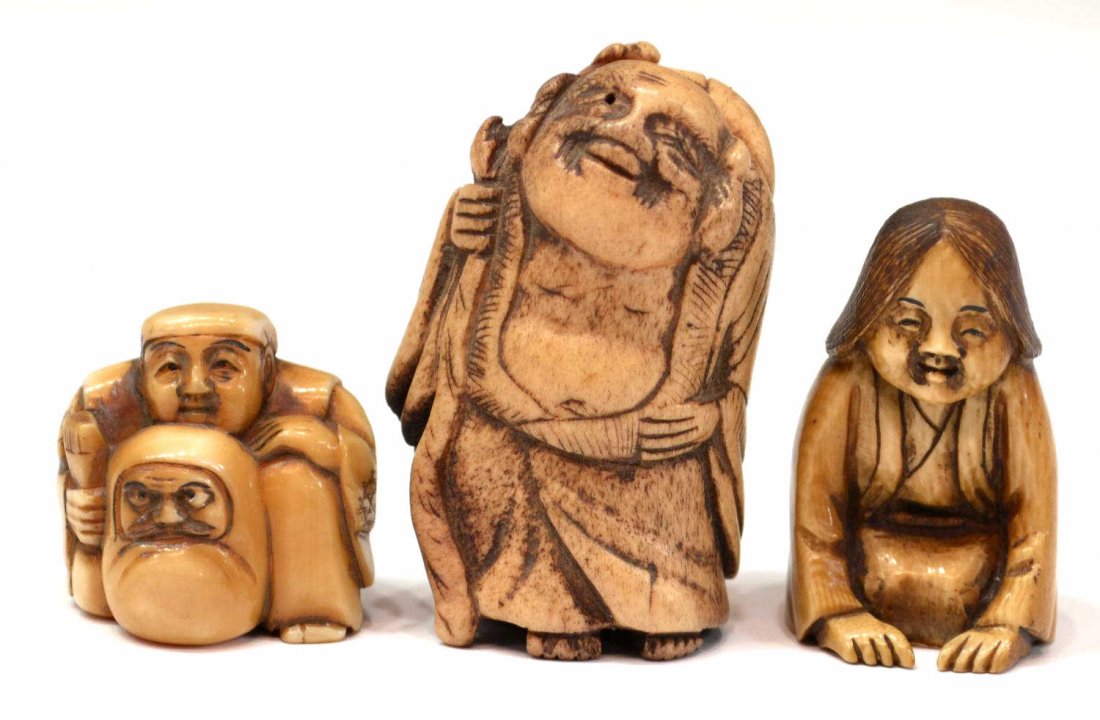 (3) JAPANESE FIGURAL CARVED IVORY NETSUKE: *This lot will not be shipped Internationally*(lot of 3) Japanese netsuke, 19th/20th century: (1) stag antler figure of Hotei with a staff, 2.25"h; (1) seated maiden with long hair, signed Ta[ ], 1.75