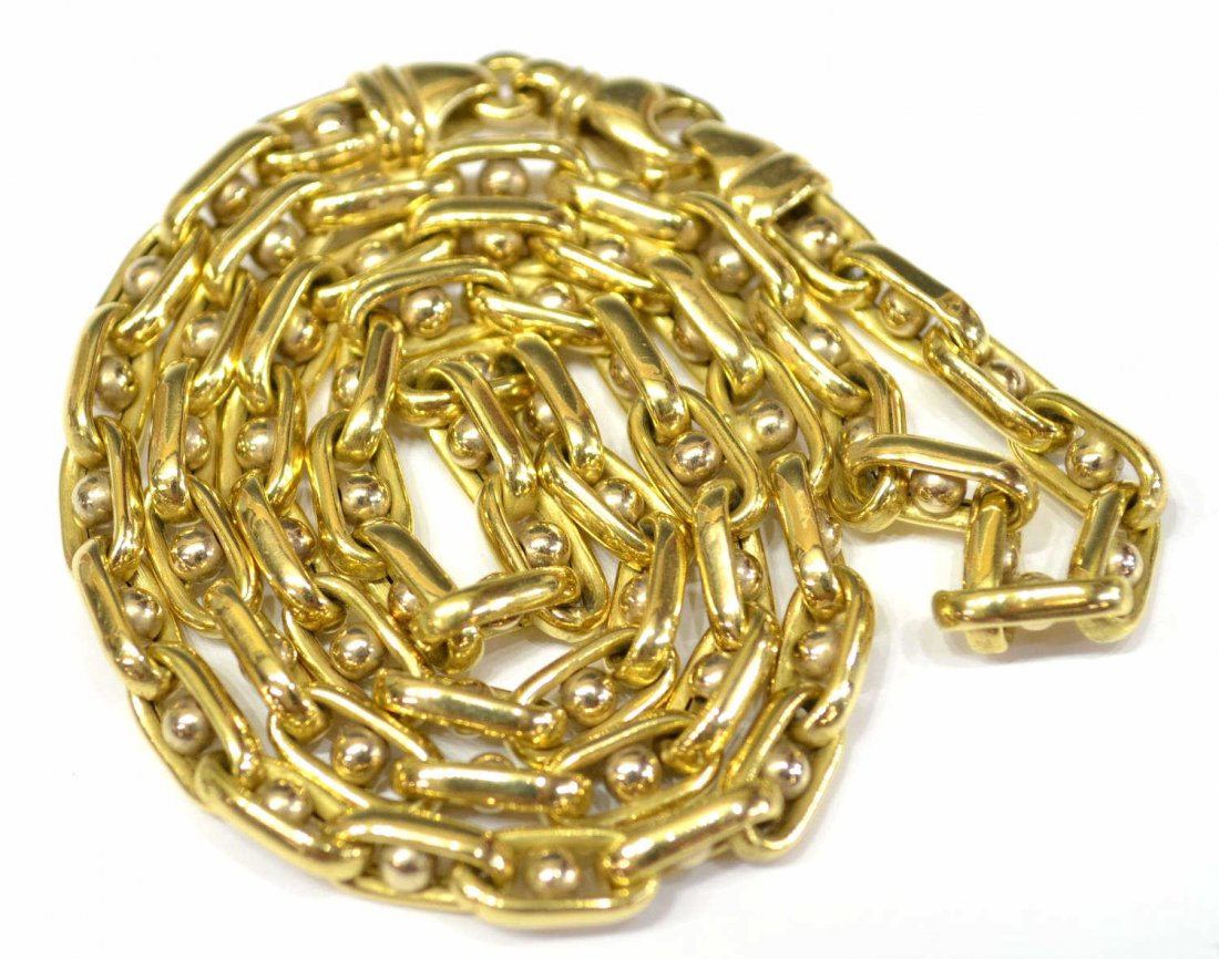 18KT YELLOW GOLD OVAL LINK & BEAD CHAIN NECKLACE: 18kt yellow gold chain, hollow oval shaped links centering a round gold ball, clasp stamped 750, approx 19"l, 26 grams Start Price: $600.00