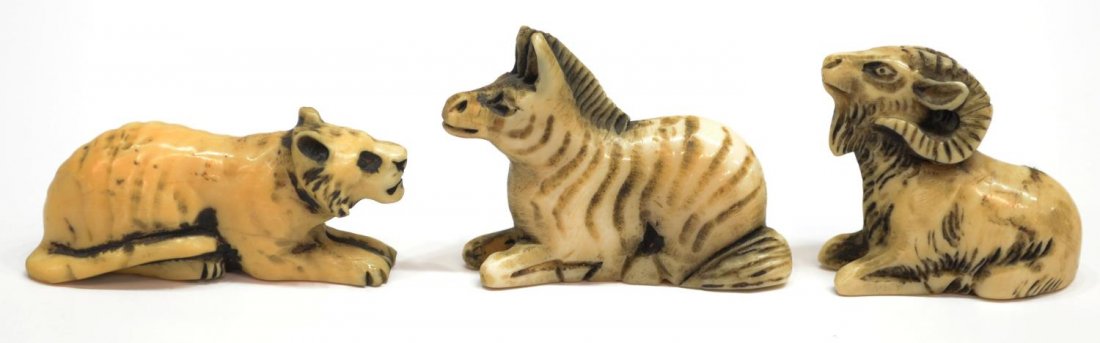 (3) JAPANESE CARVED IVORY ANIMAL NETSUKES: **International Shipping Is Not Available On This Lot** (lot of 3) Japanese carved ivory seated animal netsukes, comprisng: (1) zebra, approx. 1.25"h, 1.75"l; (1) ox or ram, approx. 1.25"h, 1.5"l, (1)