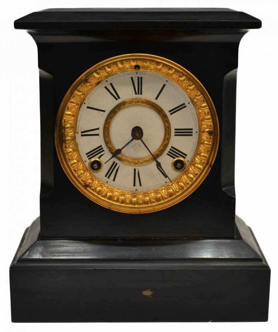ANSONIA TIME & STRIKE MANTLE CLOCK: American time and strike black metal mantle clock, Ansonia, New York, the face marked with Roman numerals and the Ansonia 'A' trade mark, enclosed in a gilt metal bezel, works marked as pictured, reta