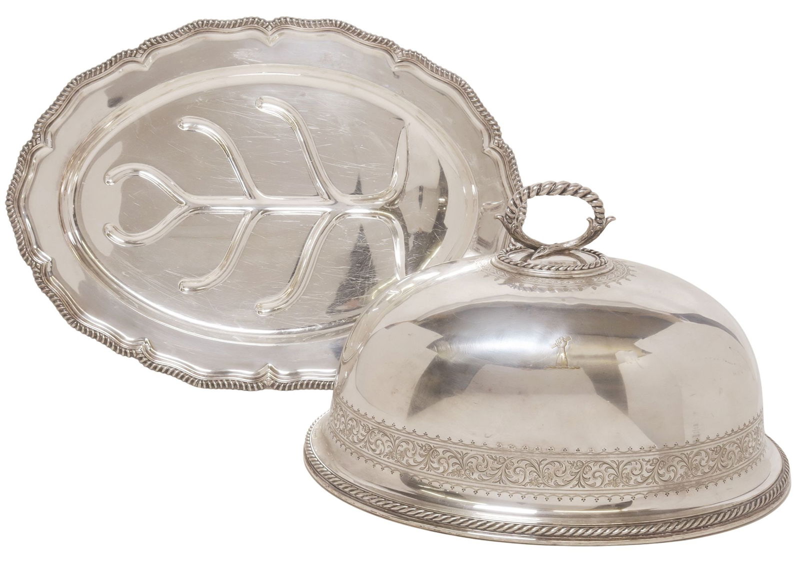 LARGE SILVERPLATE TIFFANY WELL-AND-TREE MEAT SERVING DISH & ELKINGTON DOME: Large assembled silverplate meat dish with covered dome, comprising Elkington and Company dome, Birmingham, c.1861, with twisted rope handle and trim, chased rinceau scrollwork, central engraved hand