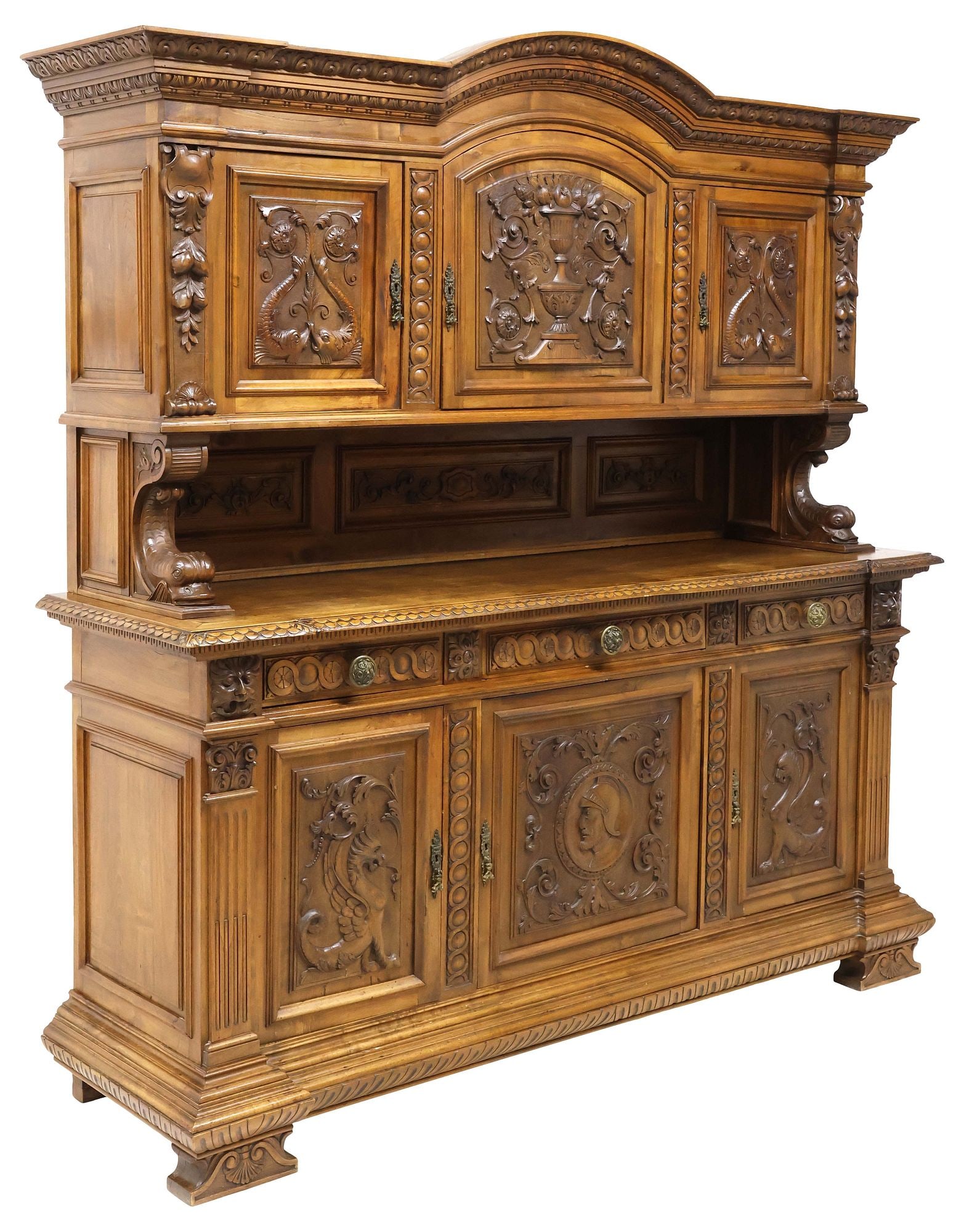 ITALIAN RENAISSANCE REVIVAL CARVED WALNUT SIDEBOARD: Italian Renaissance Revival carved walnut buffet deux corps, early 20th c., having arched crest over egg and dart trim, upper case having three cabinet doors, each with carved panel featuring scrolled