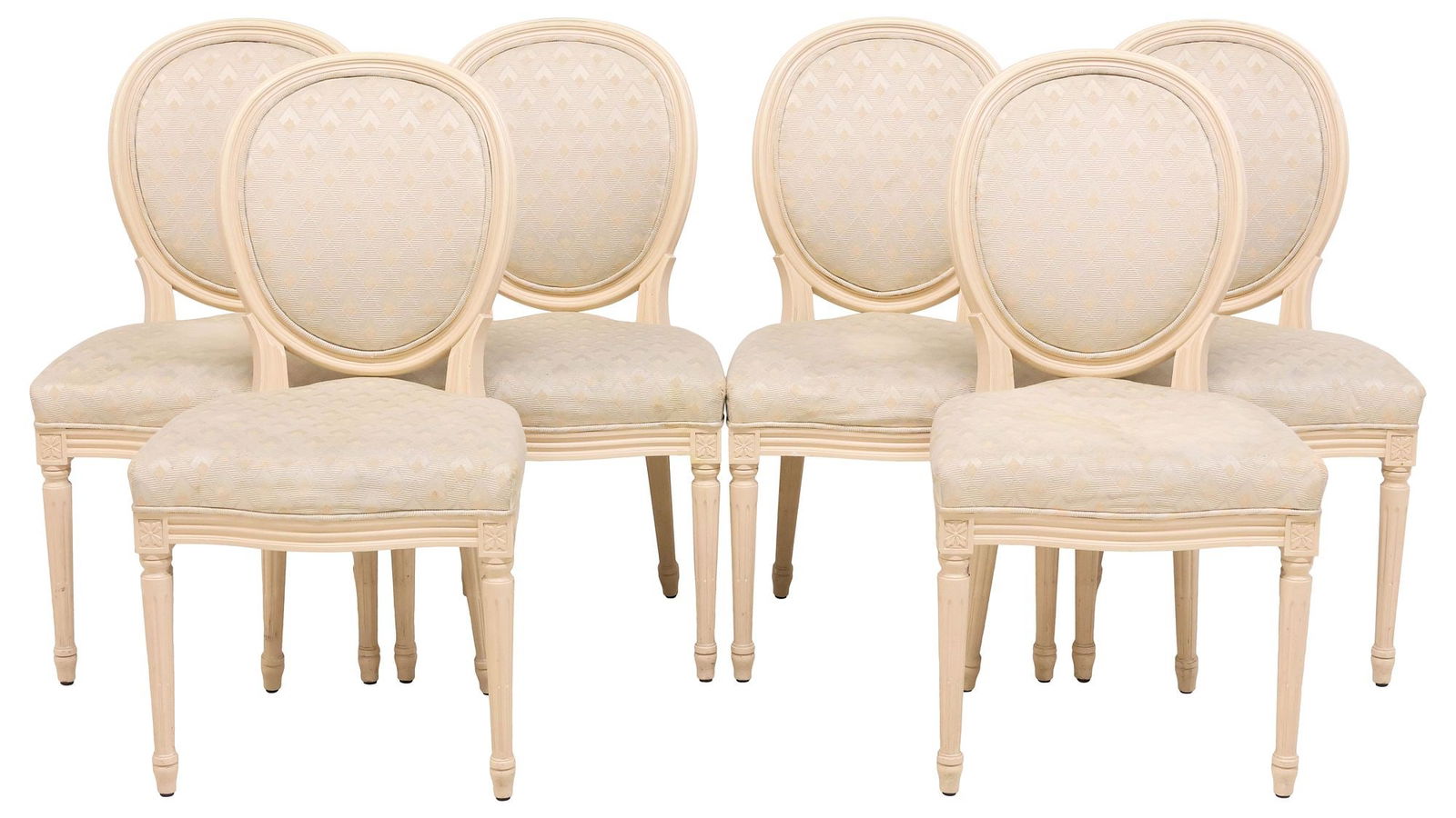 (6) FRENCH LOUIS XVI STYLE UPHOLSTERED DINING CHAIRS: (lot of 6) French Louis XVI style paint-decorated side chairs, 20th c., each in a white-painted finish, having oval medallion back and padded seat in a patterned fabric upholstery, rising on tapering
