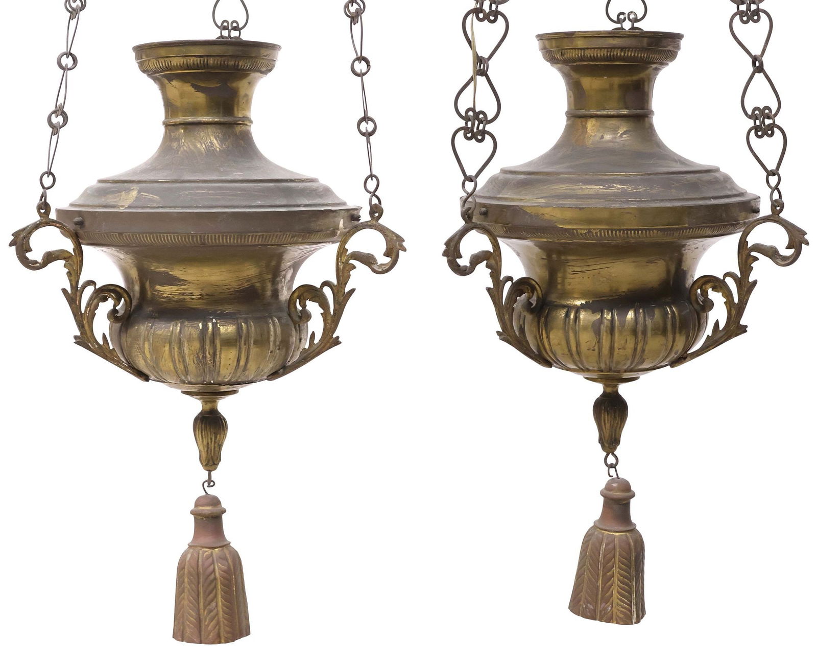 (2) ITALIAN PATINATED BRASS HANGING SANCTUARY LAMPS: (pair) Italian patinated brass sanctuary lamps, early 20th c., each with flared neck and fluted campana-form body, suspended by heart-shaped chain links, tassel-form tole drop finial with remnants of