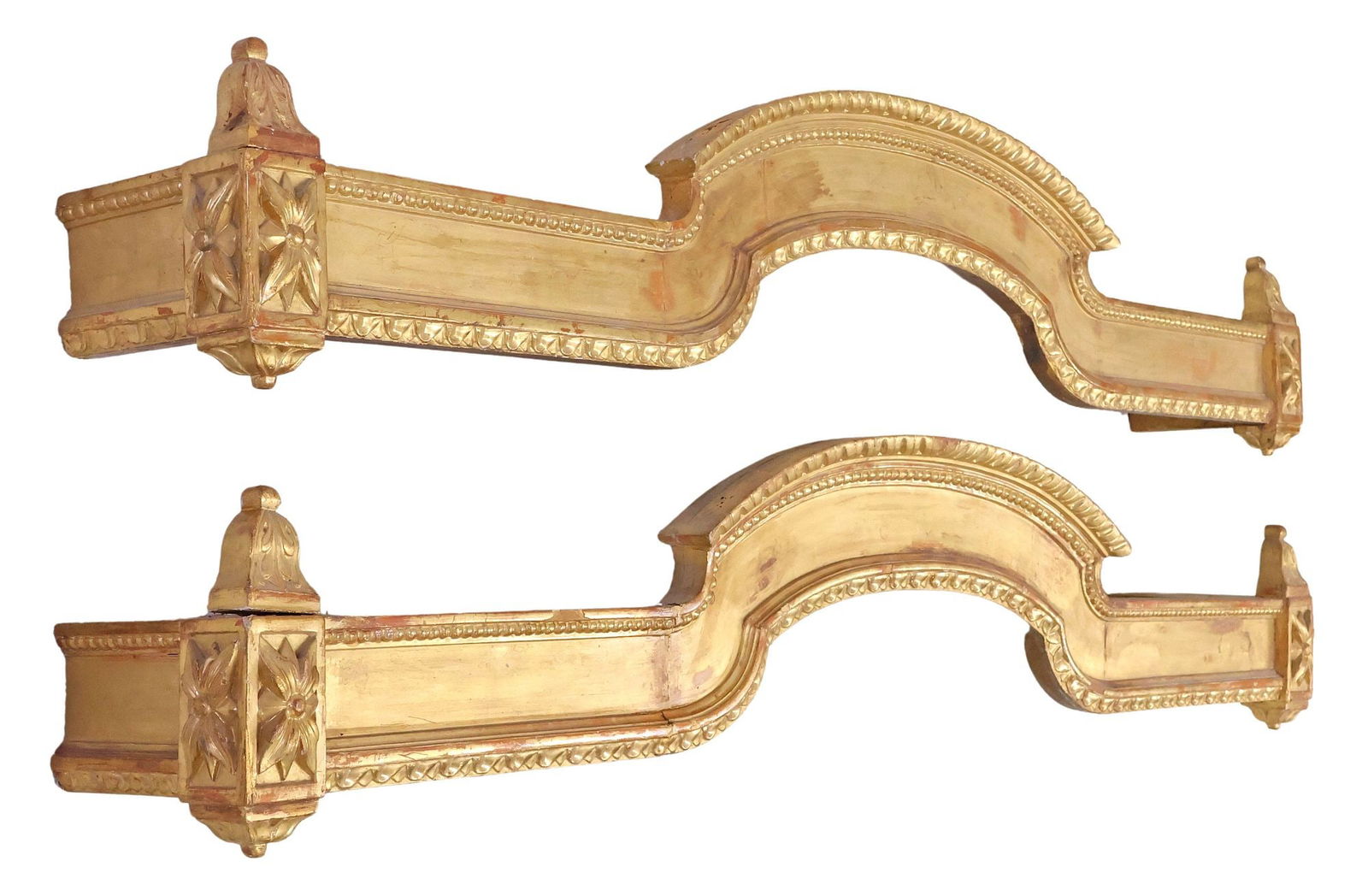 (2) ITALIAN LOUIS XVI STYLE GILTWOOD PELMET VALENCES: (pair) Italian Louis XVI style giltwood pelmets, late 19th c., gesso over wood, having an arched cornice with beaded trim, either end with foliated finials, over carved floral motifs, approx 13"h, 65.