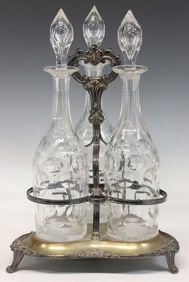 CUT GLASS DECANTERS IN SILVERPLATE STAND