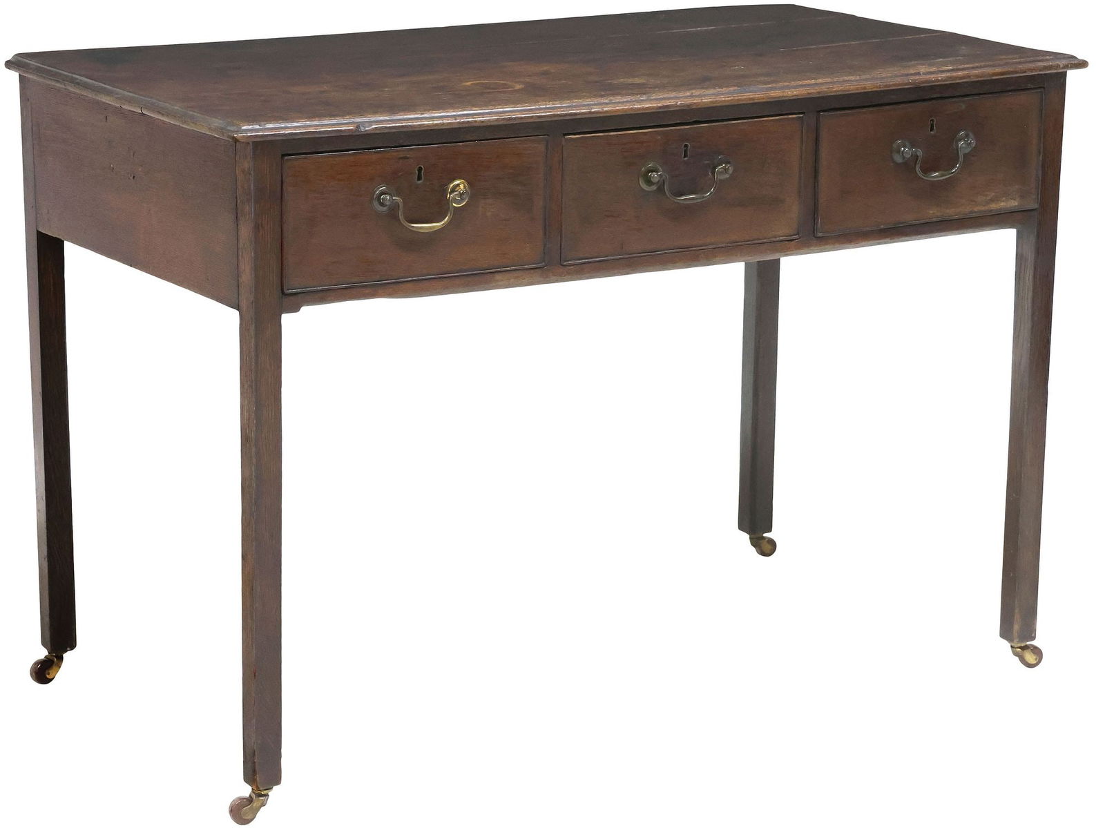 ENGLISH GEORGIAN PERIOD CARVED OAK LIBRARY TABLE: English Georgian period carved oak table, early 19th c., having rectangular top, over three drawers with metal pulls, rising on straight supports, ending on casters, approx 32"h, 47"w, 25.25"d, bottom