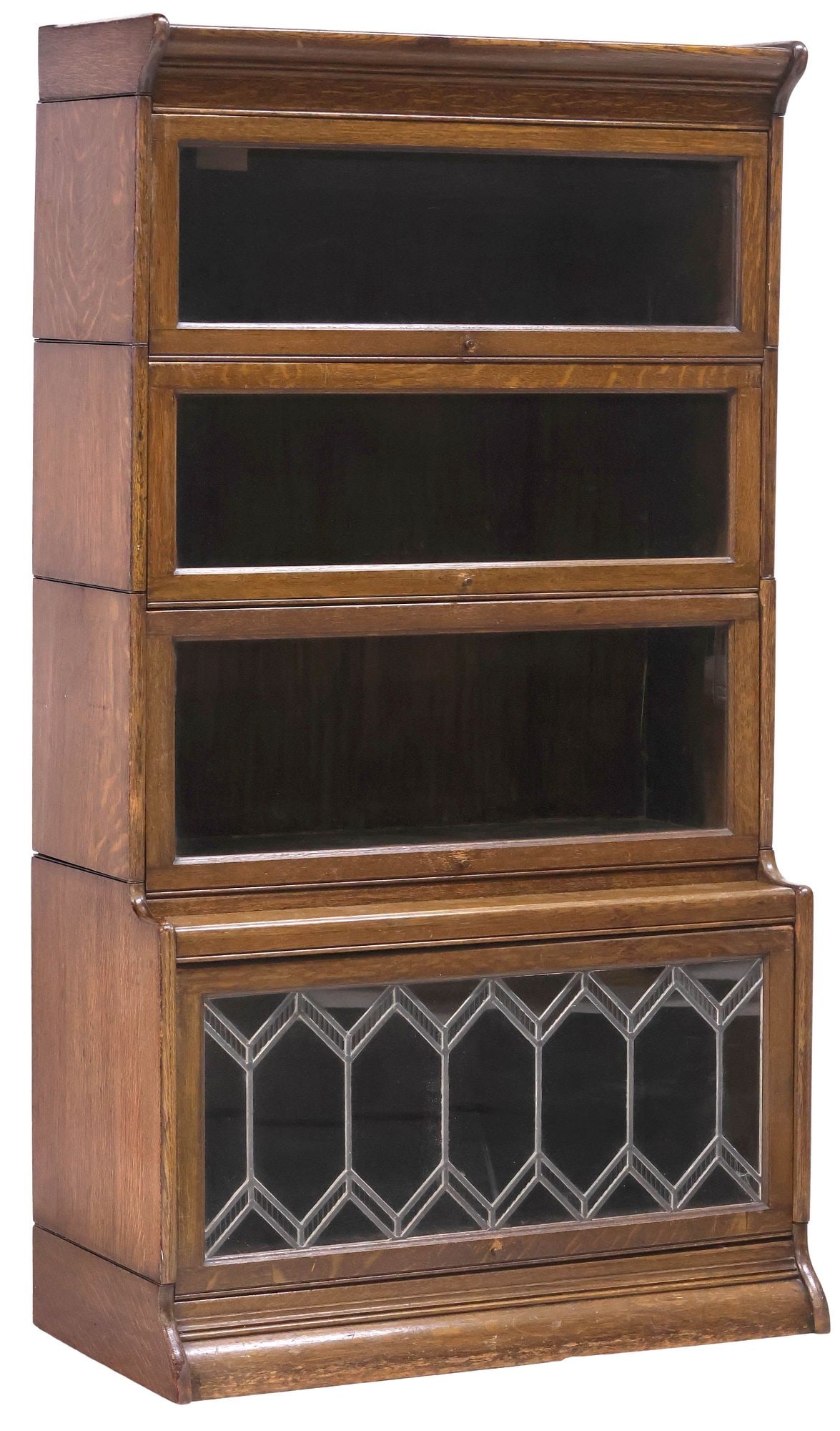 ENGLISH OAK FOUR-STACK BARRISTER'S BOOKCASE: English oak stacking barrister's bookcase, early 20th c. having corniced top, over four stacked tiers with retractable glazed doors, the lowermost with leaded glass panes, rising on conforming plinth,