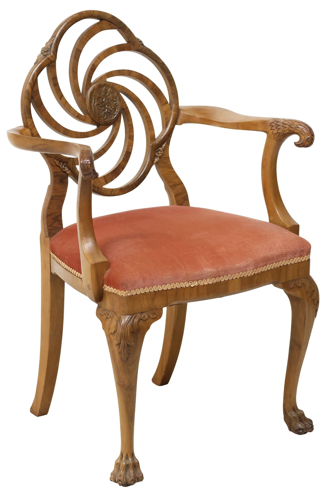 ENGLISH CARVED & UPHOLSTERED WALNUT ARMCHAIR: English carved walnut armchair, early 20th c., having openwork quatrefoil back with central floral medallion, curved arms terminating at carved eagle head handholds, padded seat in a pink upholstery w