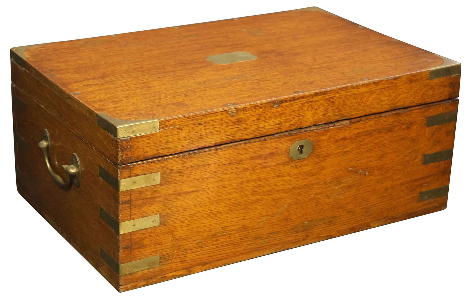 ENGLISH BRASS-MOUNTED OAK FLATWARE STORAGE BOX: English brass-bound oak box, late 19th c., hinged top with brass corner fittings, central scrollwork escutcheon, sides flanked by brass handles, inside reveals four layers of felt-lined storage, label