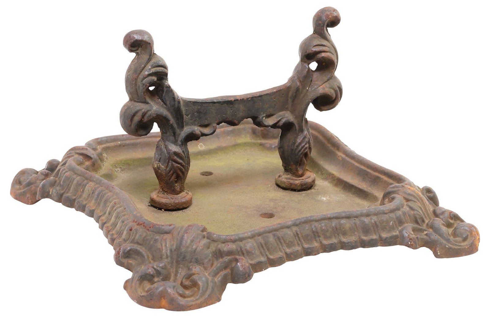 ENGLISH VICTORIAN CAST IRON BOOT SCRAPER: English Victorian cast iron boot scraper, late 19th c., central horizontal bar on scrolled supports, resting on square base, with further scrolling and foliated accents, approx 6.5"h, 12"w, 12.75"d, 1