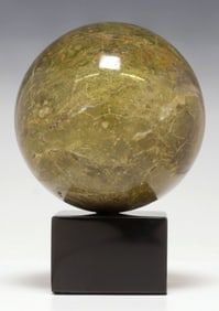 GEOLOGICAL GREEN MARBLE SPHERE ON BLACK MARBLE BASE
