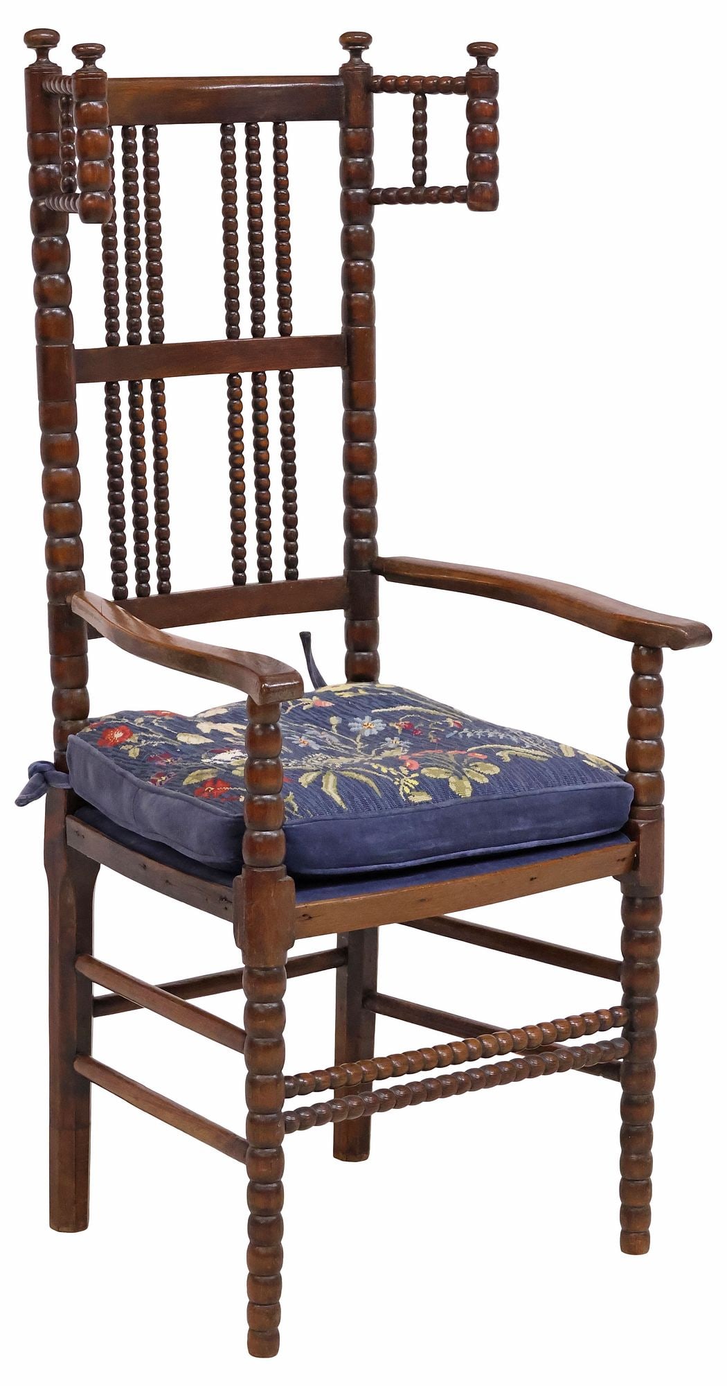 ENGLISH ERNEST GIMSON STYLE ARTS & CRAFTS BOBBIN-TURNED WINGBACK CHAIR: English Arts and Crafts carved oak wingback armchair, in the manner of Ernest William Gimson (1864-1919), late 19th c., having spindled back with bobbin-turned supports, curved armrests, padded seat w