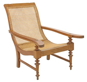 BRITISH COLONIAL TEAKWOOD PLANTATION CHAIR WITH FOLDING FOOT RESTS