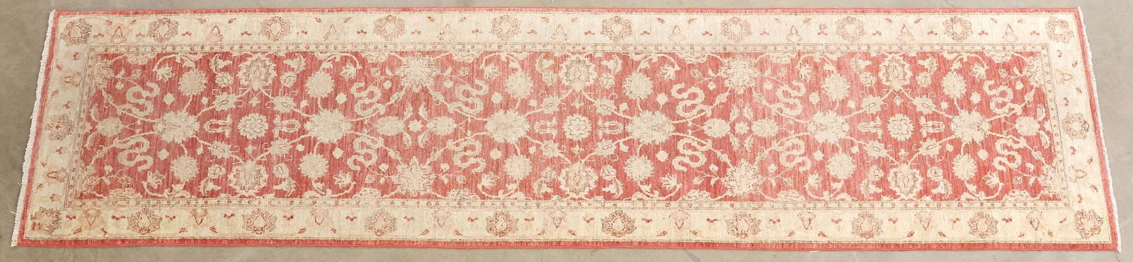 ESTATE HAND-TIED RUNNER 11'8" X 2'11": Estate hand-tied runner, approx 11'8"l, 2'11"w **Please Note: All of the rugs offered in this auction would likely benefit from a professional cleaning. Estate rugs may show some wear and imperfection