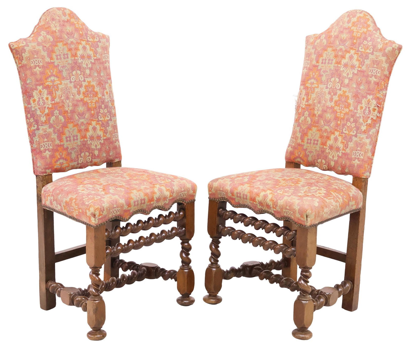 (2) BAROQUE STYLE UPHOLSTERED BARLEY TWIST HIGHBACK SIDE CHAIRS: (pair) Baroque style barley twist highback side chairs, 20thc., having shaped crest over solid splat, later upholstered in worn foliate geometric patterned fabric, with nailhead trim, over frontal bar