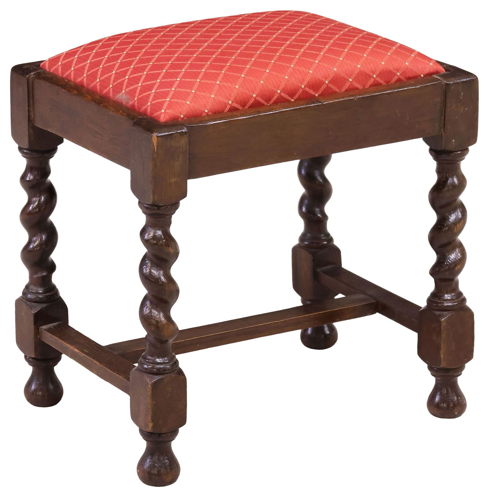 ENGLISH OAK BARLEY TWIST UPHOLSTERED FOOTSTOOL: English oak foot stool / ottoman, late 19th c., having removable padded seat in a red jacquard upholstery with diamond pattern, rising on barley twist supports joined by H-stretcher, ending on rounded