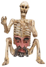 LARGE MEXICAN FOLK ART CARVED & PAINTED SEATED SKELETON MASK, 28.25"H