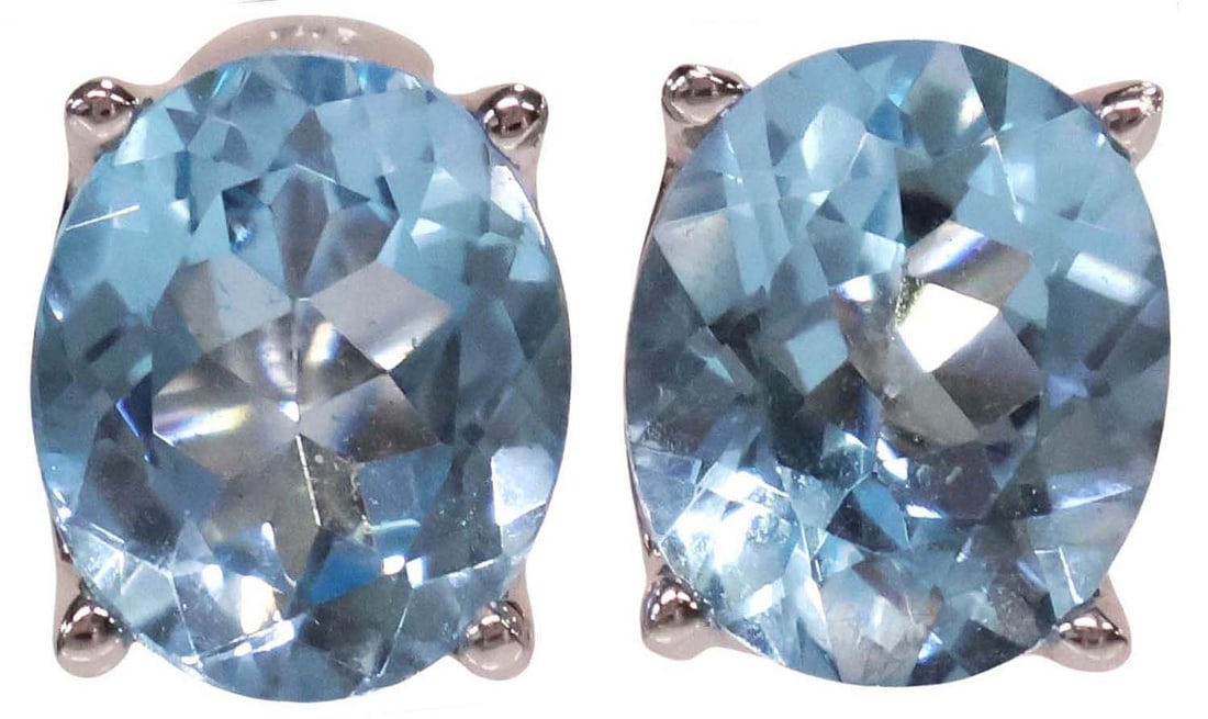 ESTATE 18KT WHITE GOLD & 11CTTW BLUE TOPAZ EARRINGS: (pair) Estate 18kt white gold and faceted oval blue topaz earrings, approx 11cttw, with hinged lever backs with star cutout, marked 750, approx 3/8"l, 8.7 grams (inclusive of all materials) **NOT