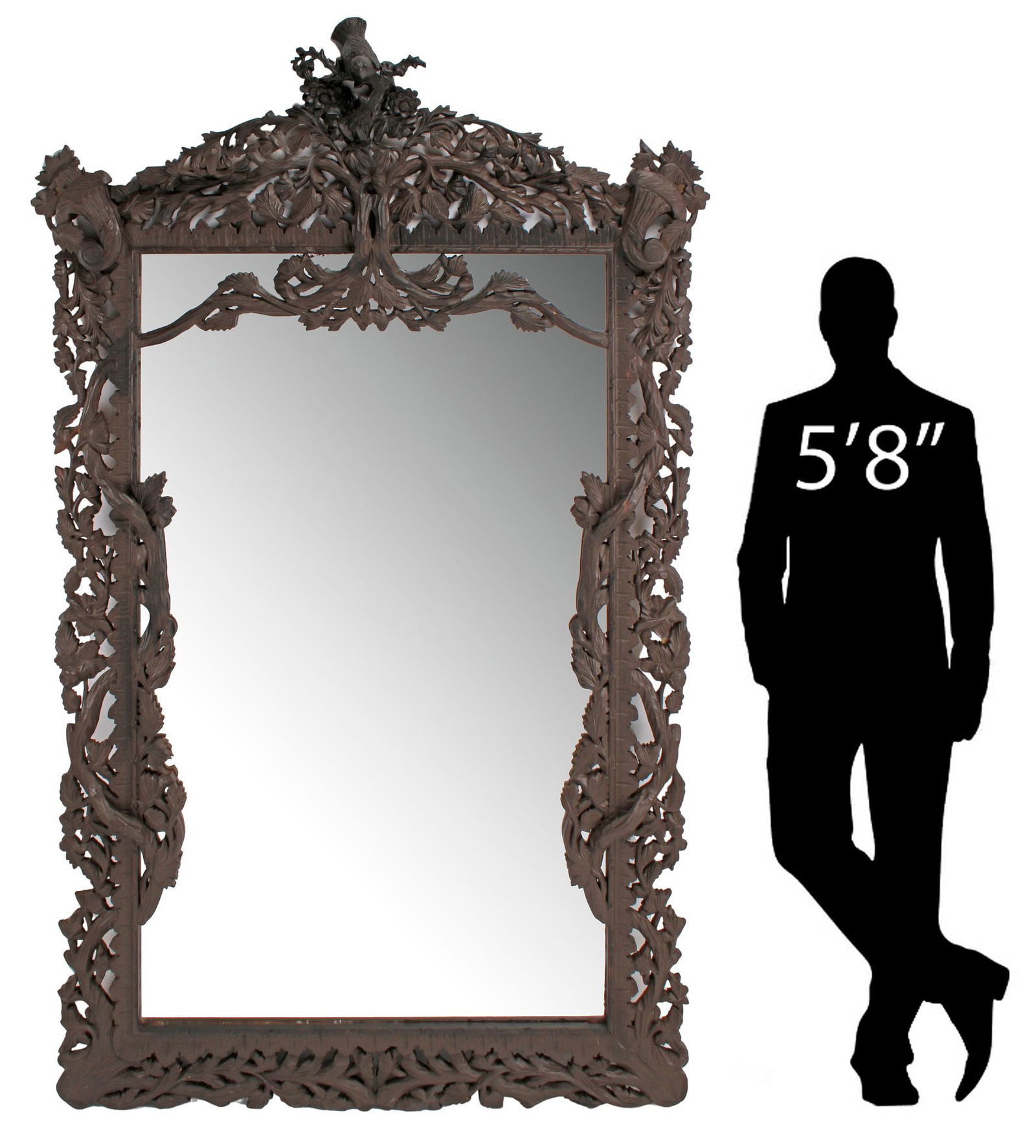MONUMENTAL BLACK FOREST STYLE FOLIATE CARVED WOOD MIRROR, 88"H: Large Black Forest style carved wood mirror, in a brown painted finish, having bird's nest crest, above pierced rectangular frame with trailing foliate vines and cornucopia motifs, encasing flat mirro