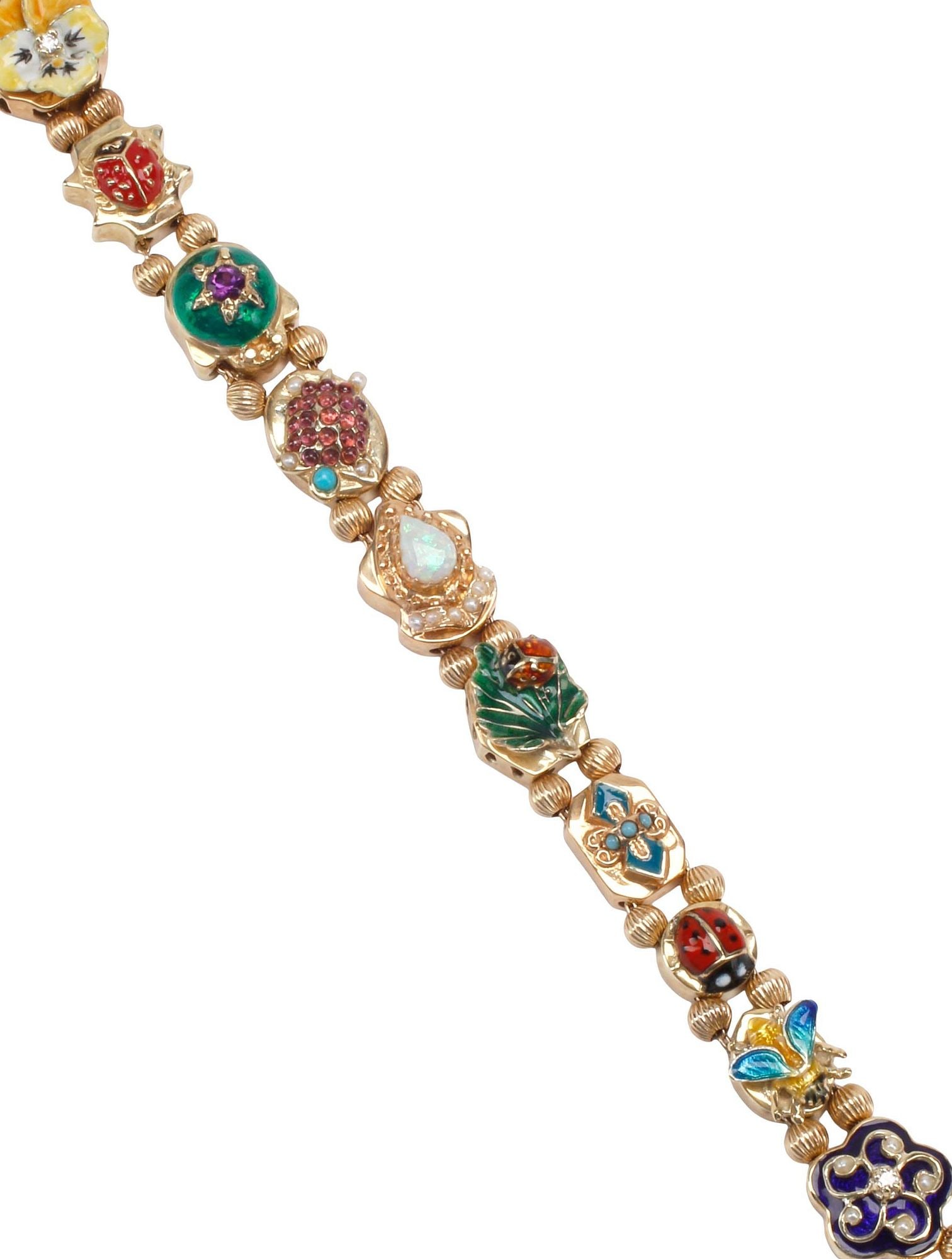 ESTATE 14KT YELLOW GOLD ENAMELED & GEMSTONE SLIDE CHARM BRACELET, 39.5 GRAMS: Estate 14kt yellow gold slide bracelet, (eleven) charms and box clasp, accented with opal, seed pearls, diamonds, various gemstones, enameled frog, lady bugs, turtle, flowers and butterfly, separated
