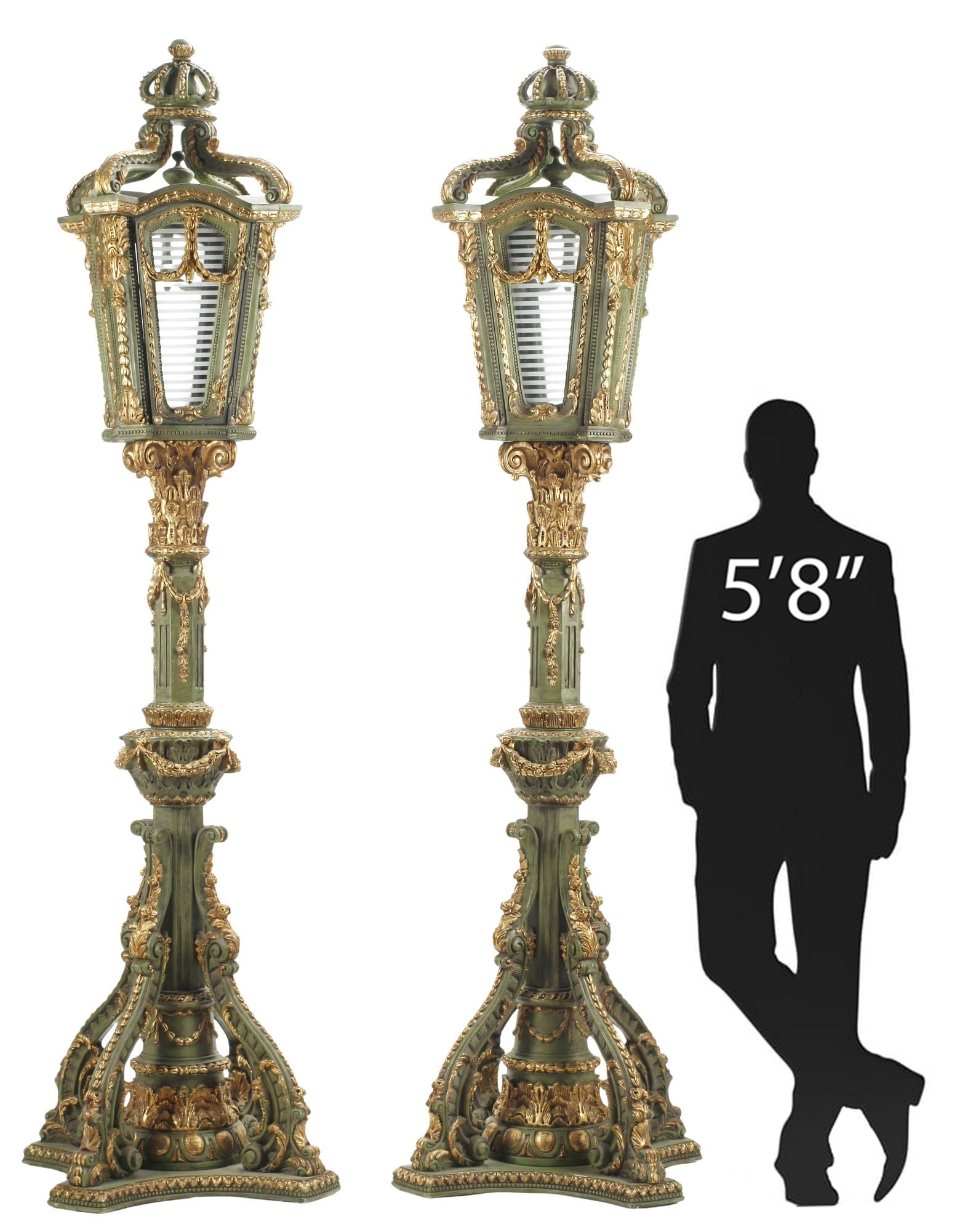 (2) LARGE BAROQUE STYLE PARCEL-GILT & PAINTED FLOOR LANTERNS, 102"H: (pair) Large Baroque style parcel gilt carved wood floor lanterns, each having crown-form finial over glazed shade, rising on fluted columnar standard with draped swag and foliate motifs, ending on tr