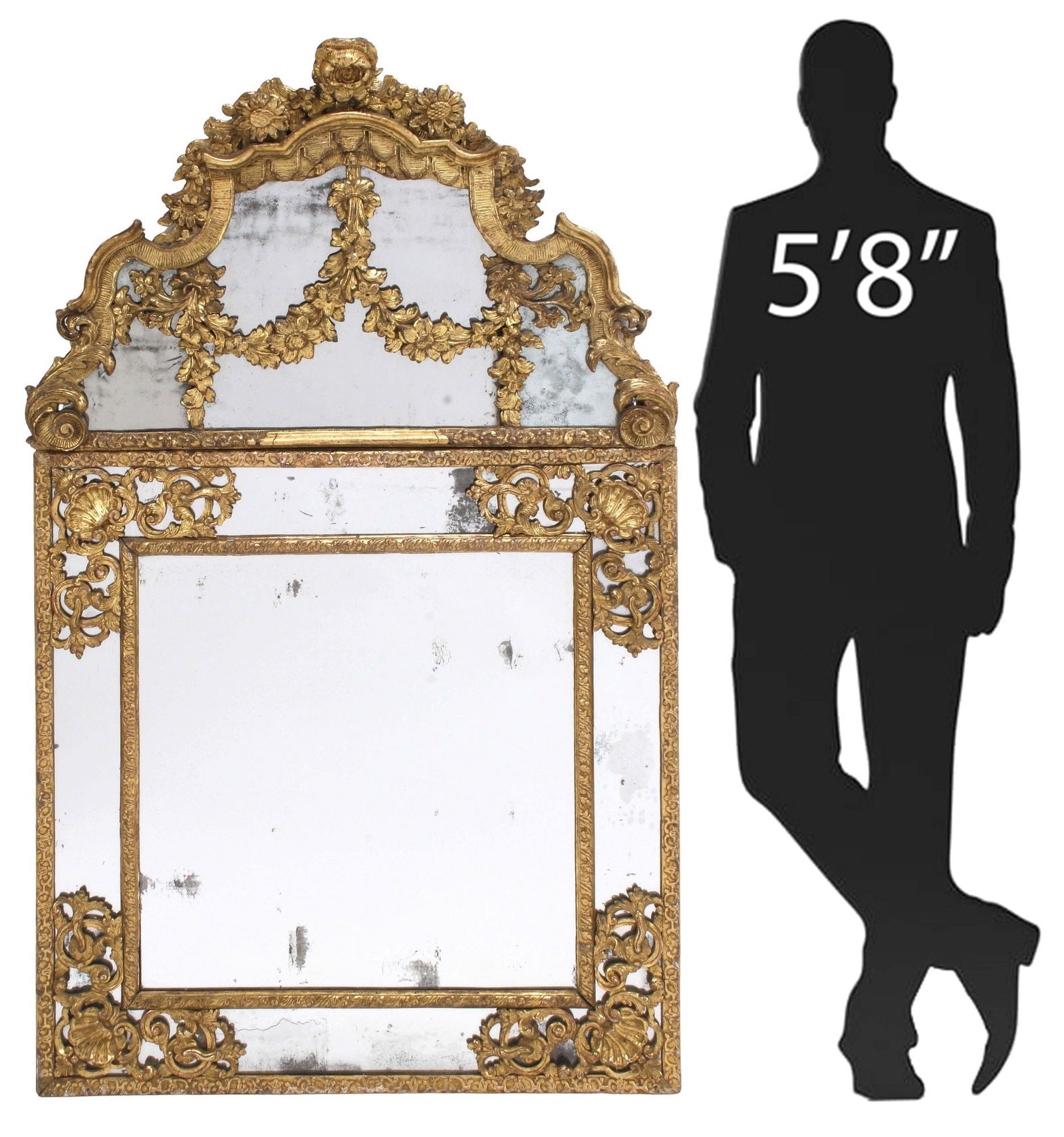 FRENCH REGENCE PERIOD CARVED GILTWOOD PARCLOSE MIRROR, 66" X 40": French Regence carved giltwood wall mirror, 18th c., the removable upper section with carved sunflower and rose crest, over shaped frame, flat mirror plate overlaid with floral swags, lower parclose m