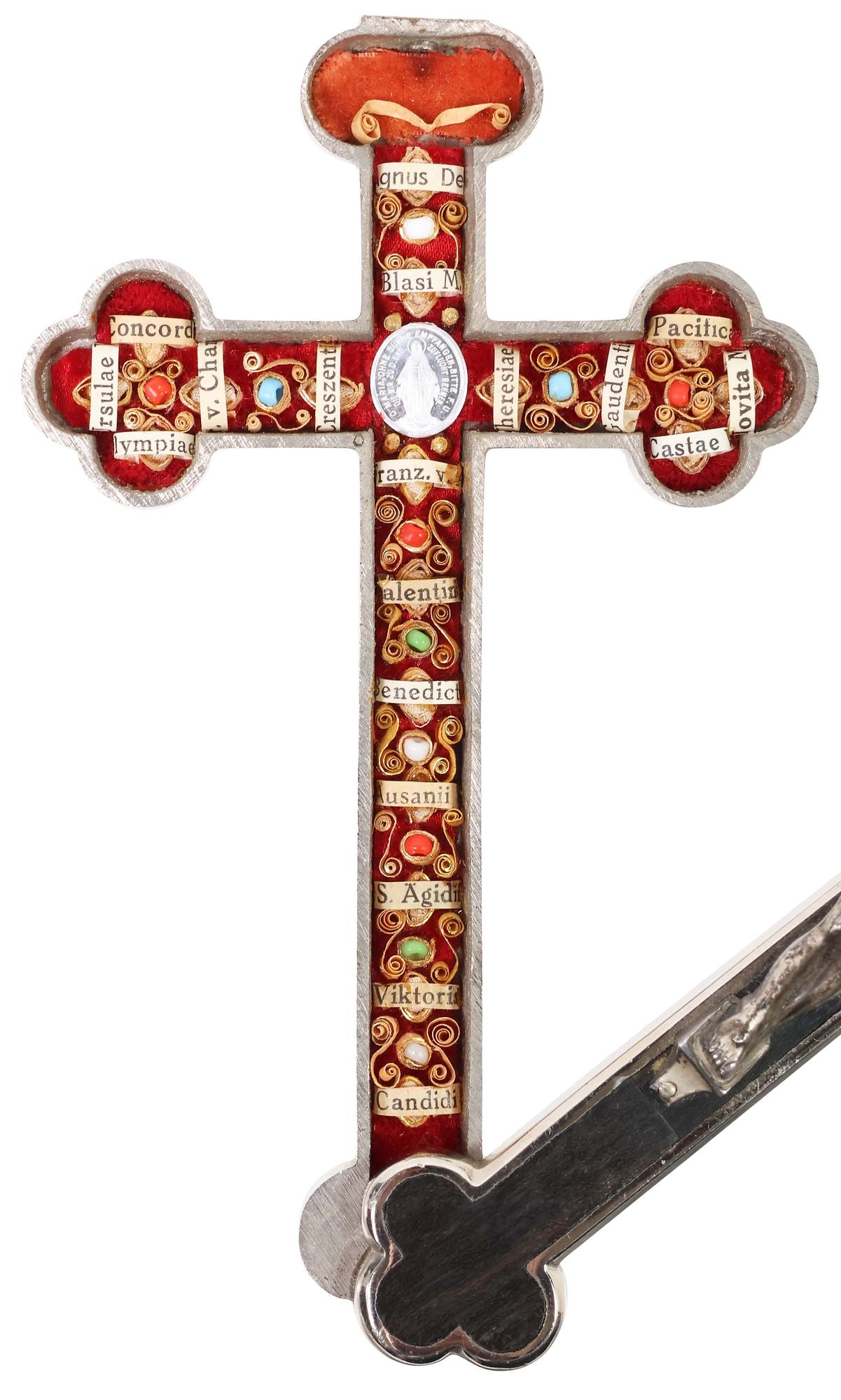 GERMAN PECTORAL RELIQUARY CROSS WITH 18 SAINTS RELICS & AGNUS DEI: German silver-tone metal and ebony-inlaid pectoral reliquary crucifix, housing (eighteen) relics of various Catholic saints, with central silver-tone Miraculous Mary pendant and Agnus Dei (Lamb of God