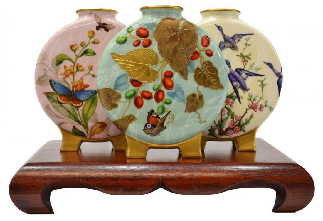 SCARCE 19TH C. ROYAL WORCESTER TRIPLE MOON VASE: (lot of 2) Royal Worcester porcelain triple moon vase, c. 1879, the vases conjoined together, finely painted with birds, butterflies, flowers and fruited trees amid foliage, parcel gilding overall, pr