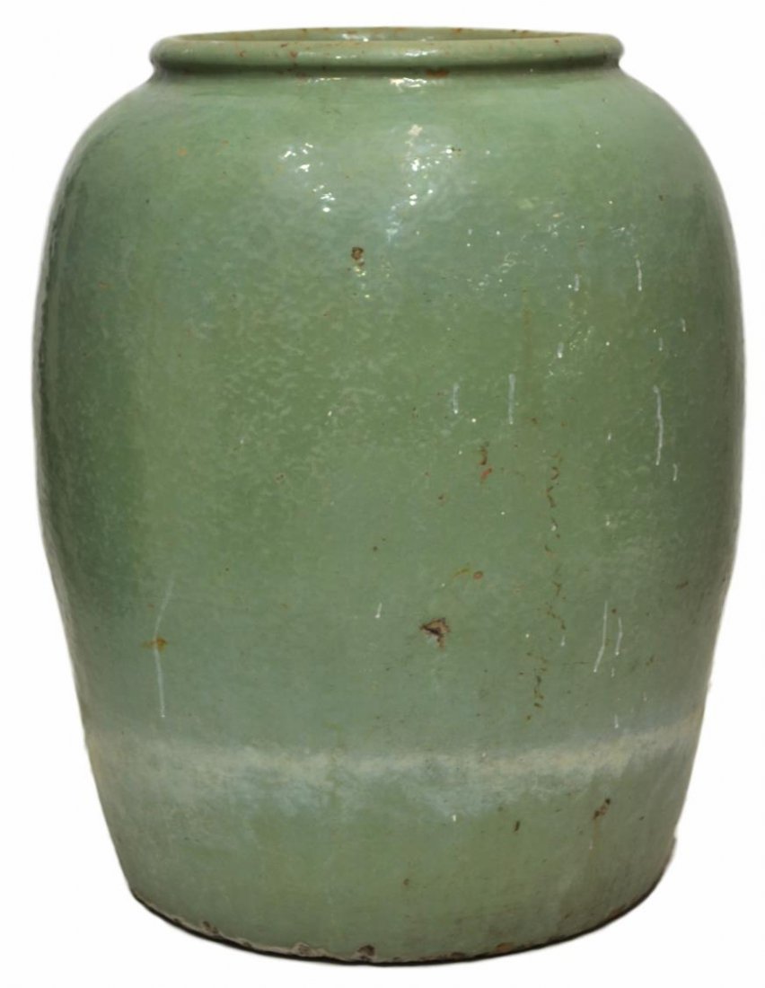 LARGE ASIAN CELADON GLAZE EARTHENWARE JAR: Large Asian earthenware jar, in a ceramic glaze, overall some wear/loss to glaze, pitting at rim, 29"h, 97.25lbs Start Price: $100.00