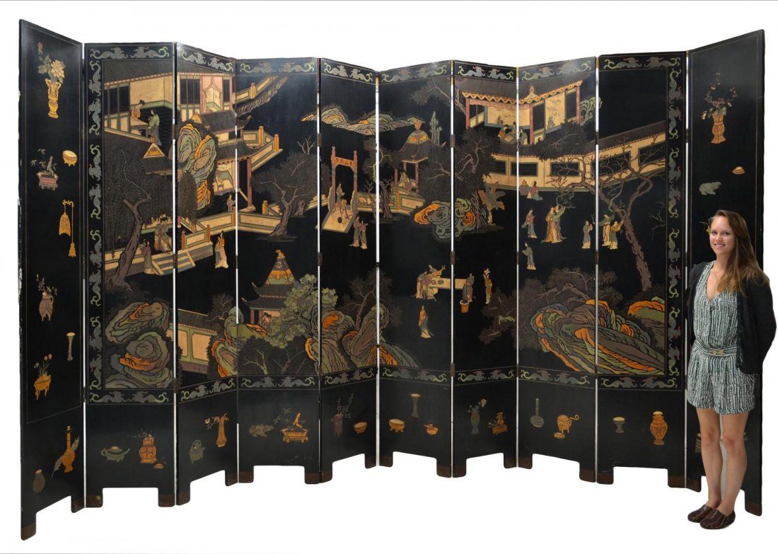 LARGE CHINESE LACQUER TEN-PANEL FOLDING SCREEN: Large Chinese lacquered ten-panel folding screen, continuous polychrome landscape scene interspersed with structures and figures at leisure, playing games, instruments, etc., border of urns, vases, an