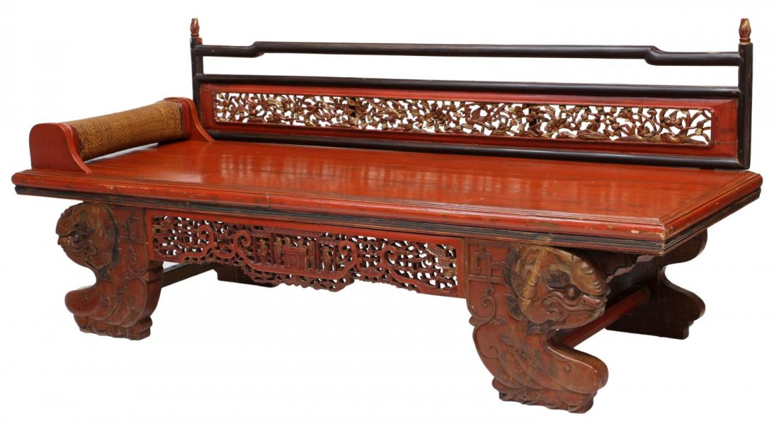 ANTIQUE CHINESE PARCEL GILT RED LACQUER DAYBED: Chinese parcel gilt red lacquer daybed, the back rest featuring pierced open work panel carved with song birds amid foliage, a woven head rest on the large platform fashioned with planks, figural leg 