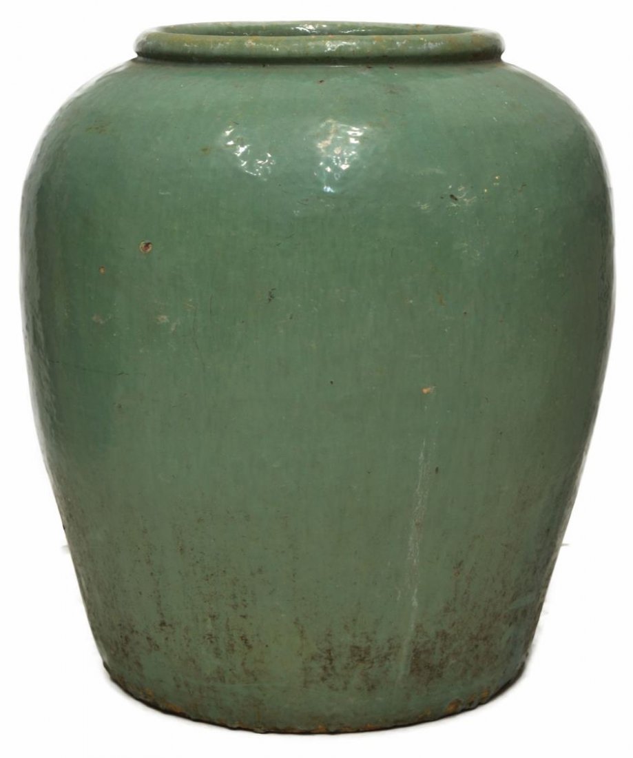 LARGE ASIAN CELADON GLAZED EARTHENWARE JAR: Large Asian earthenware jar, slightly tapered form in a celadon glaze, overall some wear/loss to glaze, pitting at rim, 27.5"h, 69.5lbs Start Price: $100.00
