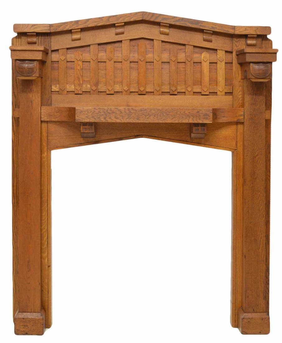 ARTS & CRAFTS MISSION OAK CARVED FIREPLACE MANTEL: Arts and Crafts oak fire surround, early 20th c., approx overall: 74.5"h, 59.5"w, 8.5"d, approx interior: 45.75"h (to apex), 41"w (to rear trim), 43.25"w (leg to leg) Start Price: $400.00