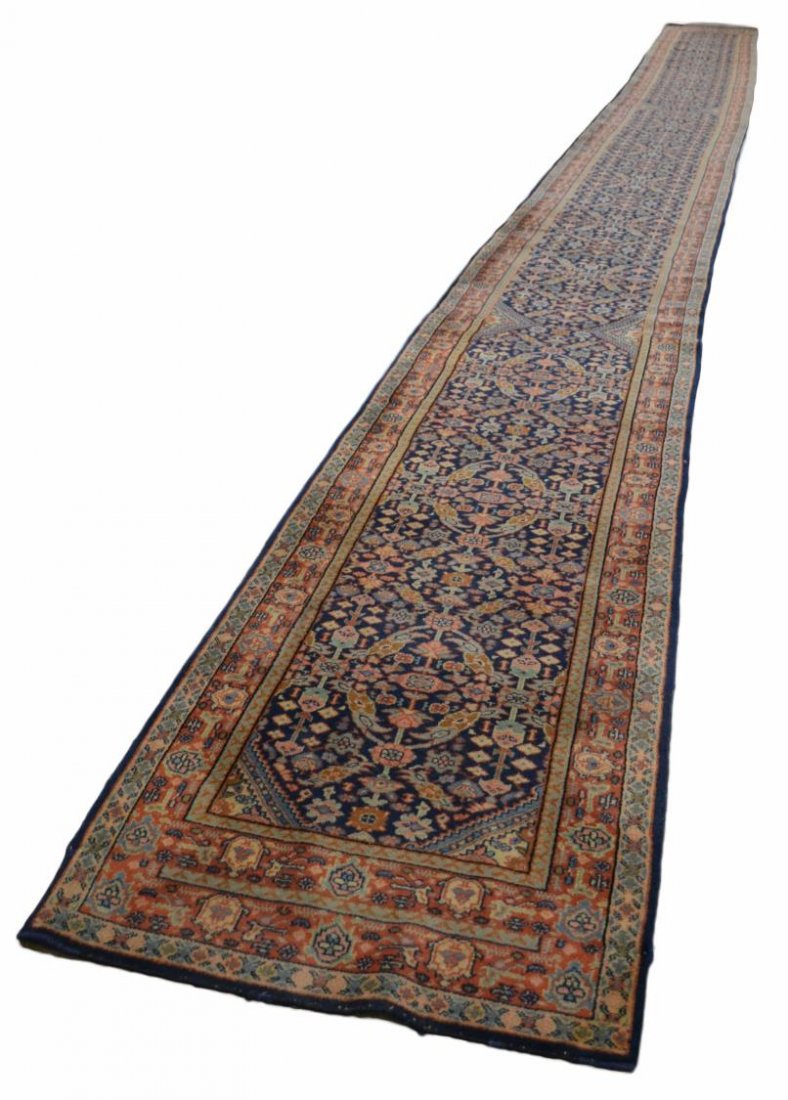 INDO-PERSIAN HAND TIED LONG RUNNER, 36'5"L: Indo-Persian hand tied long runner, rich colors in abstract foliate patterns, approx. 36'5"l, 3'1"w Start Price: $500.00