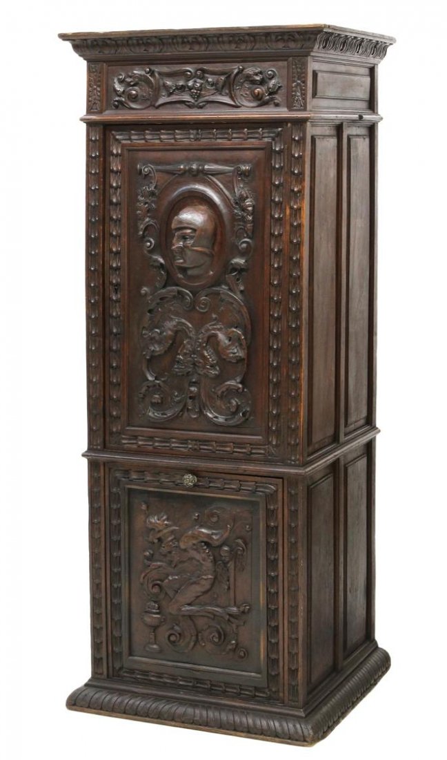 ANTIQUE RENAISSANCE REVIVAL RELIEF CARVED CUPBOARD: Renaissance Revival cupboard, 19th c., the whole carved in relief with griffins, winged grotesques and ornamented trim, the upper case having a singe door centered by a high relief portrait medallion,