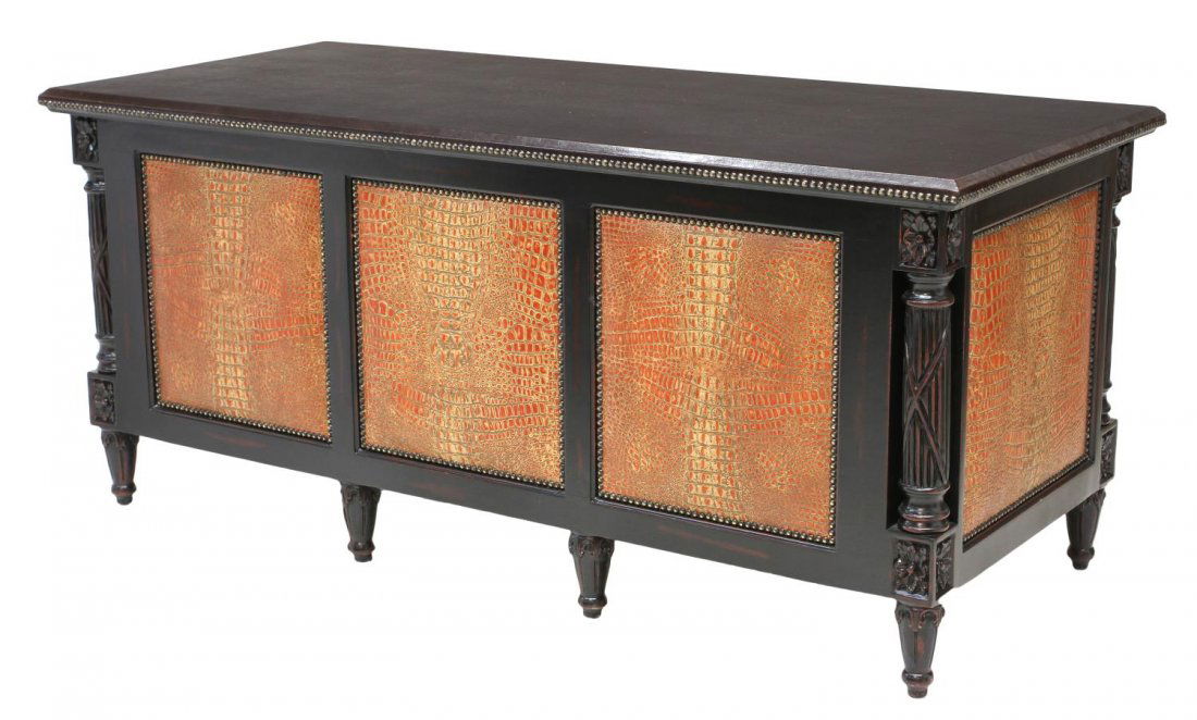 CUSTOM MADE LEATHER & CARVED WOOD EXECUTIVE DESK: Custom made executive desk, the large top in deep brown leather affixed with domed tacks, kneehole base set with seven drawers, the face and sides having leather panels in a crocodile print, raised on